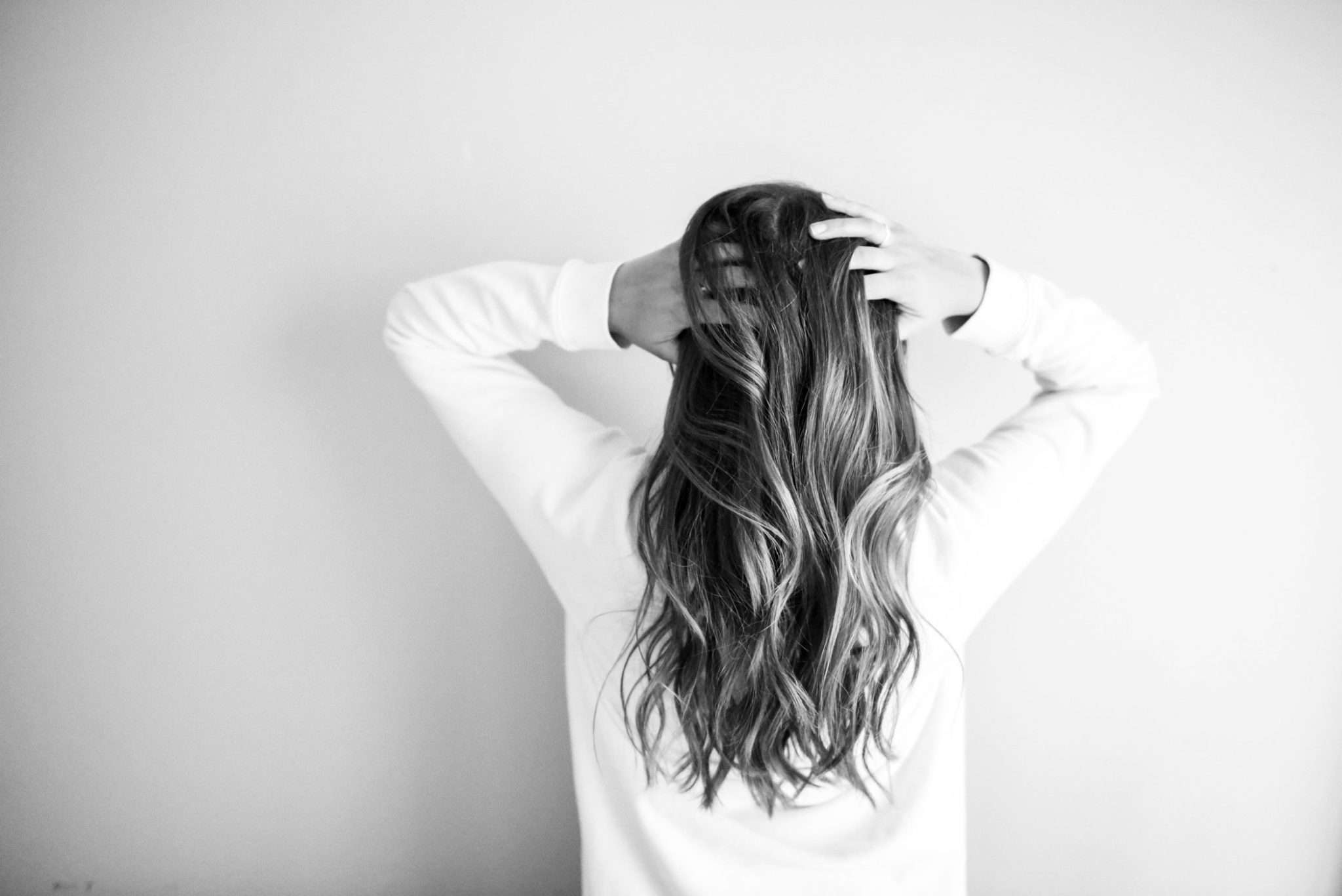 woman-wearing-white-long-sleeved-shirt-973401